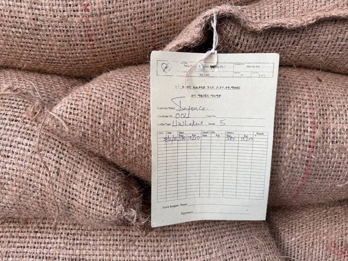 Lot documentation tag attached to a jute bag